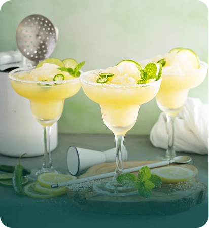Three frozen lime margaritas with mint