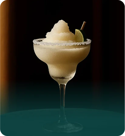 Frozen margarita with salted rim and lime